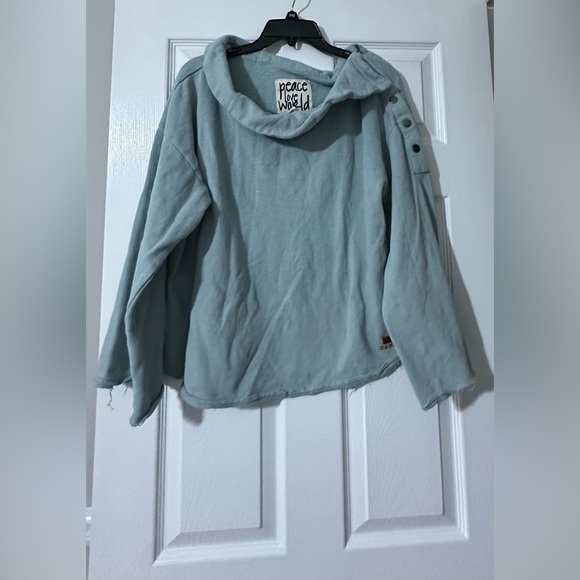 Peace Love World sweater is a size Medium. - Picture 1 of 7